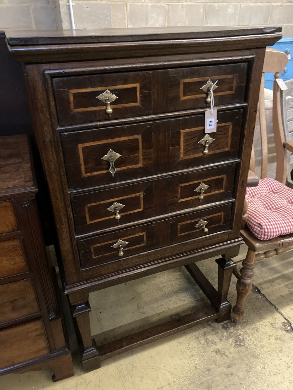 An 18th century style linenfold moulded oak and walnut chest on stand, width 73cm, depth 55cm, height 121cm